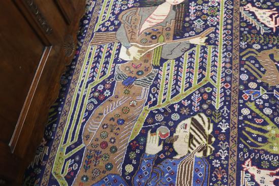A Persian rug woven with two figures 203 x 114cm